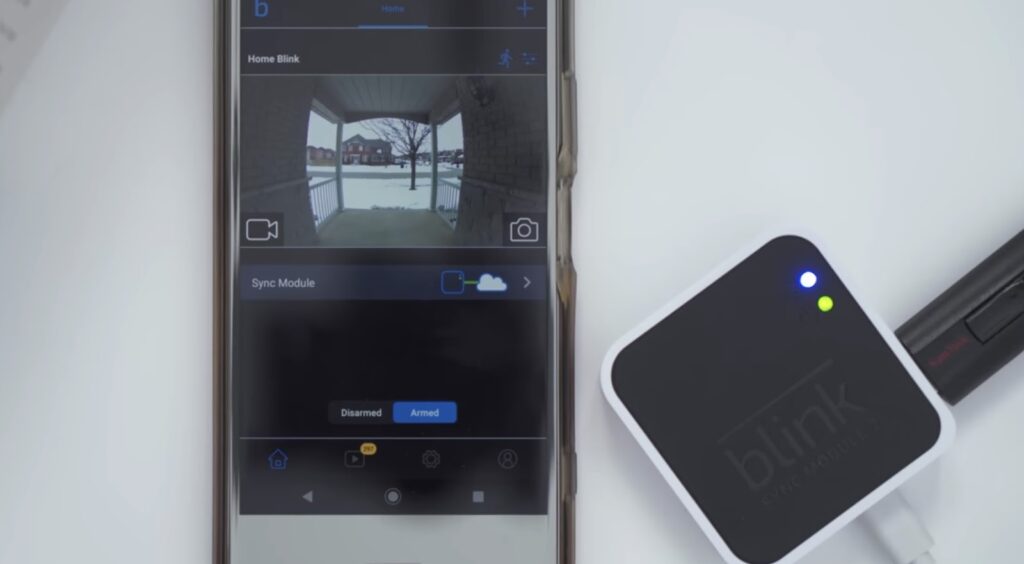 A smartphone displaying the Blink home security camera feed