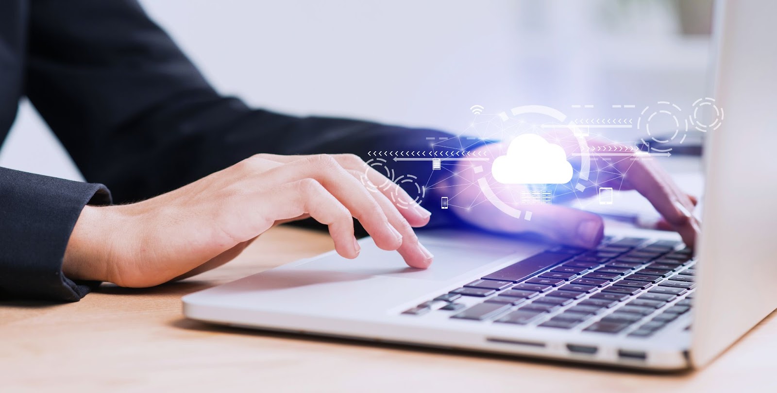 Close up of man typing on laptop