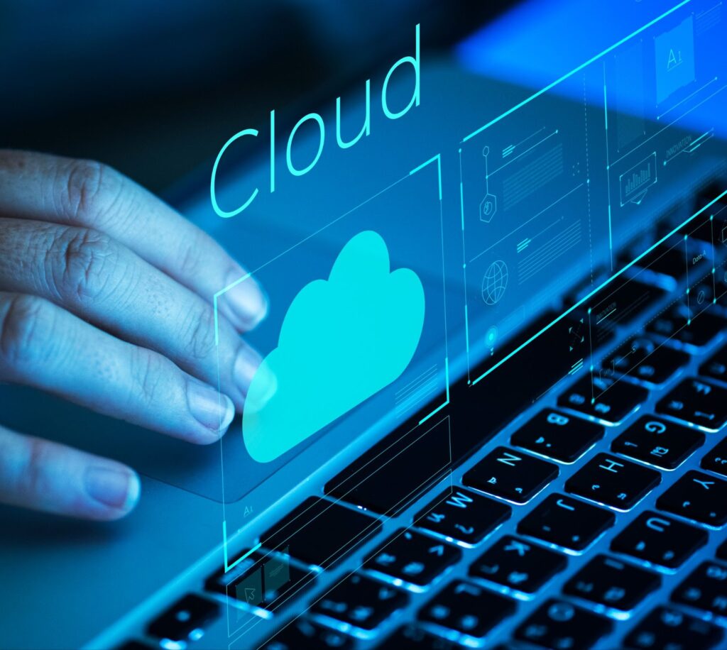 Woman scrolling on a laptop through cloud