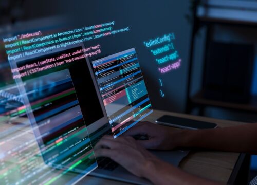 man working with code on his computer